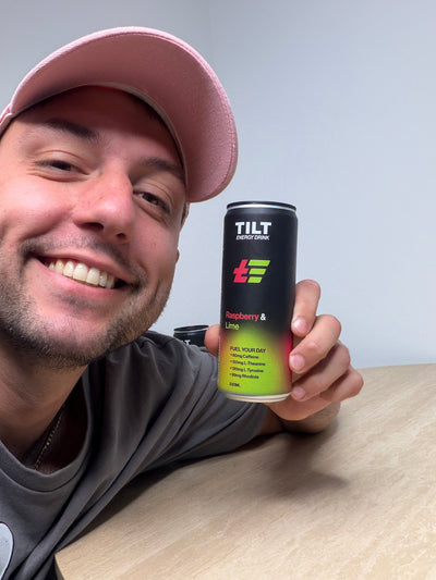 Hold a Australian Made TILT ENERGY DRINK RASPBERRY LIME CAN